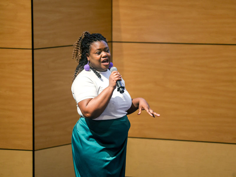 woman speaking on stage