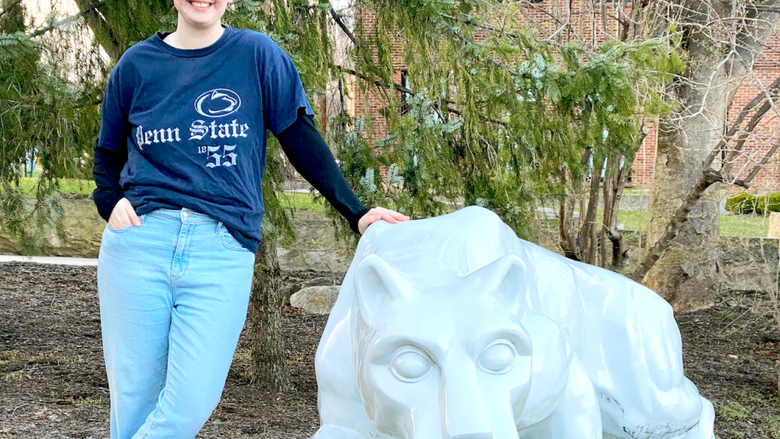 Gracie Guerin standing next to Nittany Lion statue, Penn State's mascot