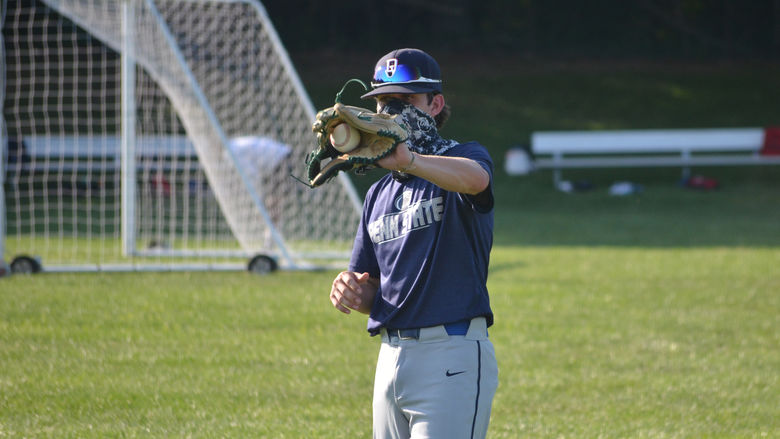 A Penn State Brandywine baseball player catching a ball. 