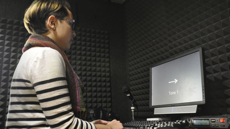 student in soundproof booth