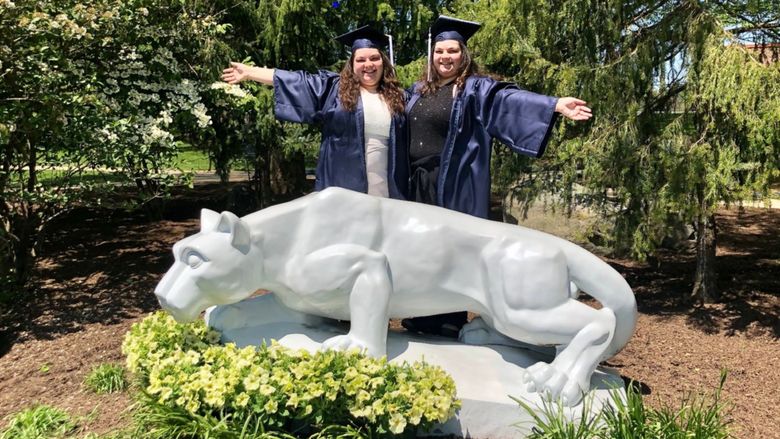 Twin sisters Chloe and Claudia Przybylski at the Penn State Brandywine Lion Shrine.
