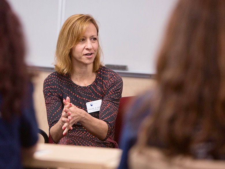 Female faculty member advising students