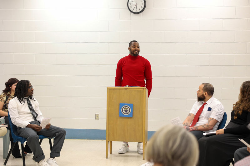 Sharif Smith standing at podium