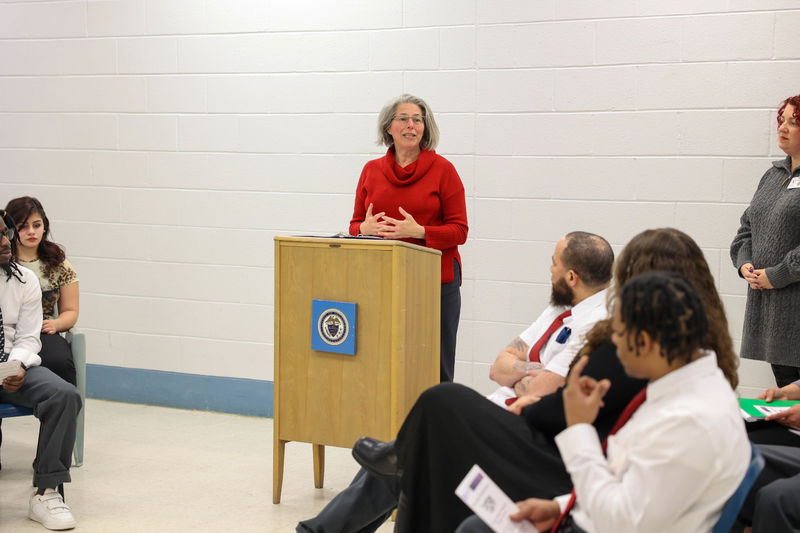 Jennifer Nesbitt speaking at podium