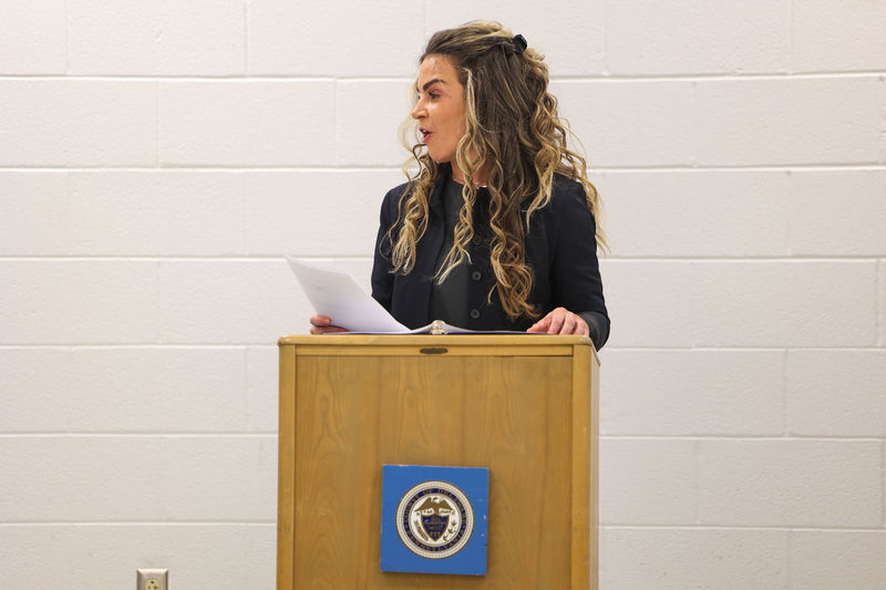 Kelly Shaw speaking at a podium