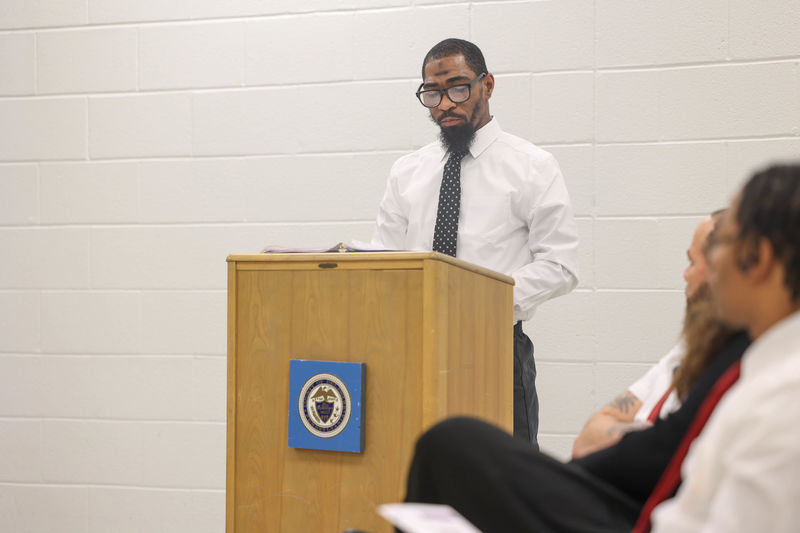 James speaking at a podium