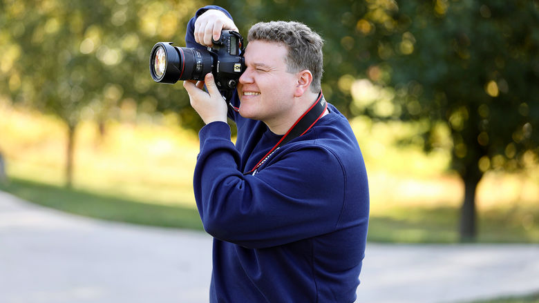 Mike McDade taking a photo at Penn State Brandywine