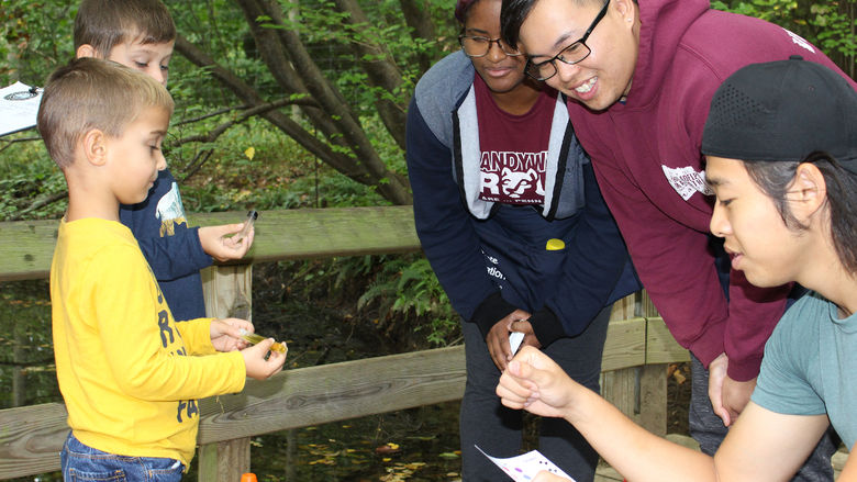 Penn State Brandywine students teaching children at Tyler Arboretum. 