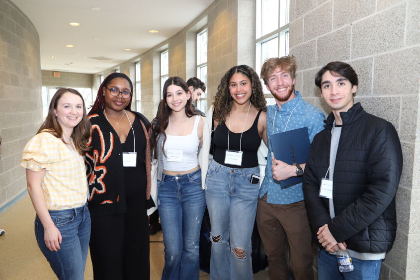 students and professor posing for photo